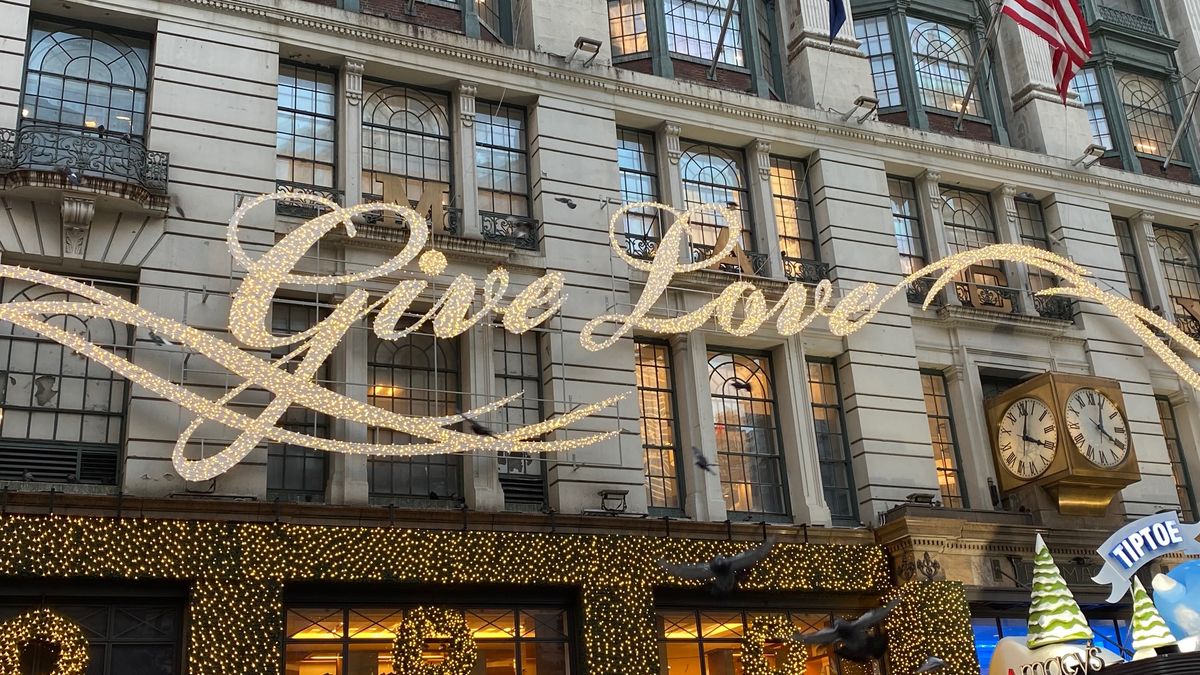 Give Love is in lights on the storefront of Macy's in Herald Square in NYC.